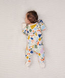 Newborn baby wearing an ergoPouch Long Sleeve Layer 1.0 TOG Fruit Salad