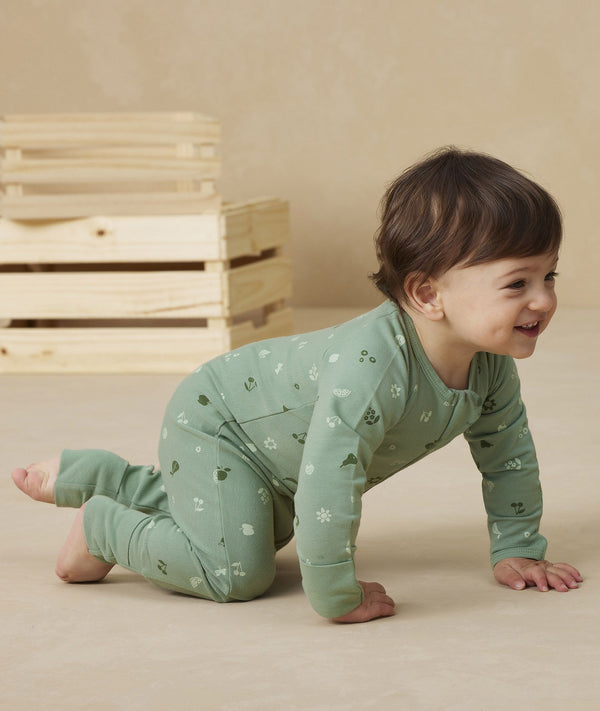 Baby wearing an ergoPouch Long Sleeve Layer 1.0 TOG Sweet Orchard