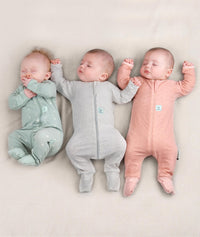 Newborn baby wearing an ergoPouch Long Sleeve Layer 0.2 TOG Sage
