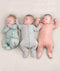 Newborn baby wearing an ergoPouch Long Sleeve Layer 0.2 TOG Berries