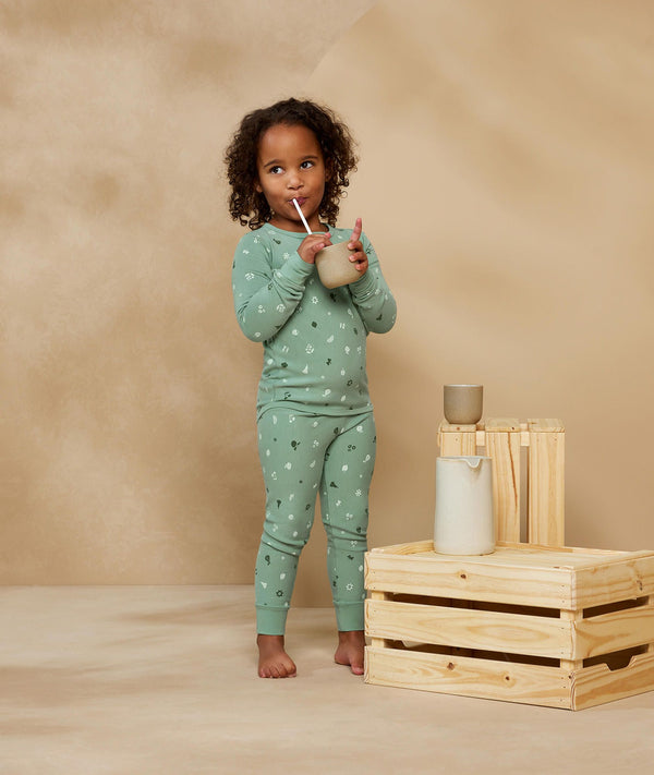 Preschooler wearing 2-piece ergoPouch Long Sleeve Pyjamas 1.0 TOG Sweet Orchard