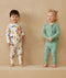 Toddler wearing 2-piece ergoPouch Long Sleeve Pyjamas 1.0 TOG Sweet Orchard