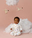 Infant sitting in ergoPouch Long Sleeve Layer 1.0 TOG Daydream