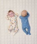 Babies lying down in ergoPouch Long Sleeve Layer 1.0 TOG in Petit Pretzel and Bon Appetit