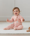 Baby wearing an ergoPouch Long Sleeve Layer 1.0 TOG Daisies