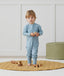 Toddler wearing an ergoPouch Long Sleeve Layer 1.0 TOG Dragonflies