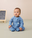 Infant sitting in ergoPouch Long Sleeve Layer 1.0 TOG Petit Pretzel