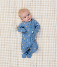 Baby lying in ergoPouch Long Sleeve Layer 1.0 TOG in Petit Pretzel
