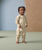 Smiling toddler in ergoPouch Long Sleeve Layer 1.0 TOG Savannah