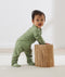 Baby wearing an ergoPouch Long Sleeve Layer 1.0 TOG Willow