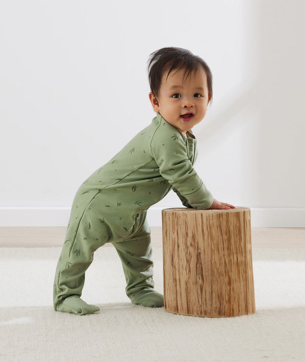 Baby wearing an ergoPouch Long Sleeve Layer 1.0 TOG Willow