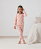 Big kid wearing 2-piece ergoPouch Long Sleeve Pyjamas 1.0 TOG Daisies