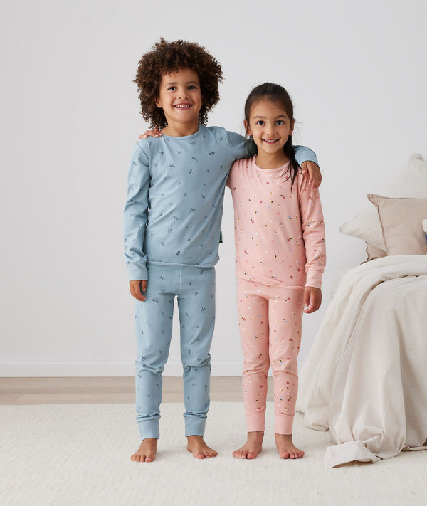 Big kids wearing 2-piece ergoPouch Long Sleeve Pyjamas 2.0 TOG Dragonflies