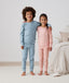 Big kids wearing an ergoPouch Long Sleeve Pyjamas 1.0 TOG Daisies