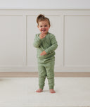 Toddler wearing 2-piece ergoPouch Long Sleeve Pyjamas 1.0 TOG Willow