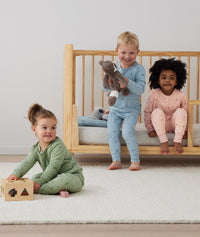 Toddler wearing 2-piece ergoPouch Long Sleeve Pyjamas 1.0 TOG Willow