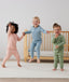 Toddler wearing 2-piece ergoPouch Long Sleeve Pyjamas 1.0 TOG Dragonflies