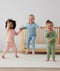 Toddler wearing 2-piece ergoPouch Long Sleeve Pyjamas 1.0 TOG Willow