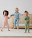 Toddler wearing 2-piece ergoPouch Long Sleeve Pyjamas 1.0 TOG Willow