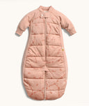 Peach-colored quilted baby sleep suit bag with long sleeves and front zipper, featuring a subtle all-over animal print.