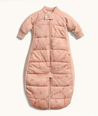 Peach-colored quilted baby sleep suit bag with long sleeves and front zipper, featuring a subtle all-over animal print.