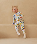 Toddler wearing a warm, ergoPouch Sleep Onesie 3.5 TOG Fruit Salad