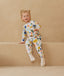 Toddler wearing an ergoPouch Sleep Onesie 2.5 TOG Fruit Salad