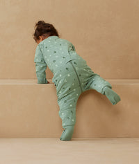 Toddler wearing an ergoPouch Sleep Onesie 2.5 TOG Sweet Orchard