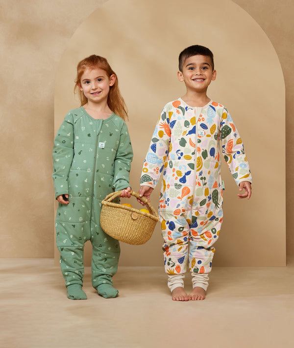 Preschooler wearing an ergoPouch Sleep Onesie 2.5 TOG Fruit Salad
