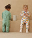 Toddler wearing an ergoPouch Sleep Onesie 2.5 TOG Fruit Salad
