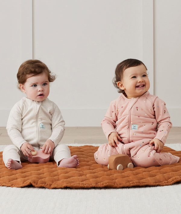 Baby wearing an ergoPouch Sleep Onesie 2.5 TOG Daisies