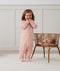Toddler wearing an ergoPouch Sleep Onesie 2.5 TOG Daisies
