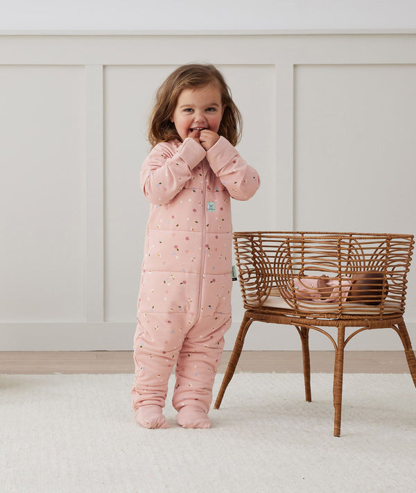 Toddler wearing an ergoPouch Sleep Onesie 2.5 TOG Daisies