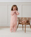 Toddler wearing an ergoPouch Sleep Onesie 2.5 TOG Daisies