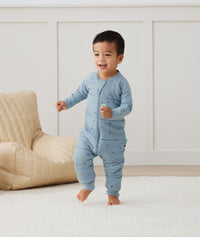 Toddler wearing an ergoPouch Sleep Onesie 2.5 TOG Dragonflies