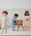 Toddler wearing a warm, ergoPouch Sleep Onesie 3.5 TOG Oatmeal Marle