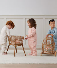 Toddler wearing an ergoPouch Sleep Onesie 2.5 TOG Oatmeal Marle