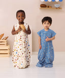 Two toddlers wearing ergoPouch Sleep Suit Bags 0.2 TOG in Bon Appetit & Petit Pretzel