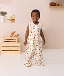 Toddler smiling wearing ergoPouch Jersey Sleep Suit Bag 0.2 TOG in Bon Appetit