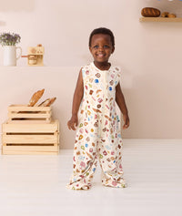 Toddler smiling wearing ergoPouch Jersey Sleep Suit Bag 0.2 TOG in Bon Appetit
