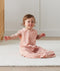 Toddler wearing ergoPouch Sleep Suit Bag 0.2 TOG Daisies