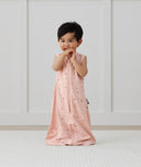 Toddler wearing ergoPouch Sleep Suit Bag 0.2 TOG Daisies