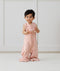 Toddler wearing ergoPouch Sleep Suit Bag 0.2 TOG Daisies