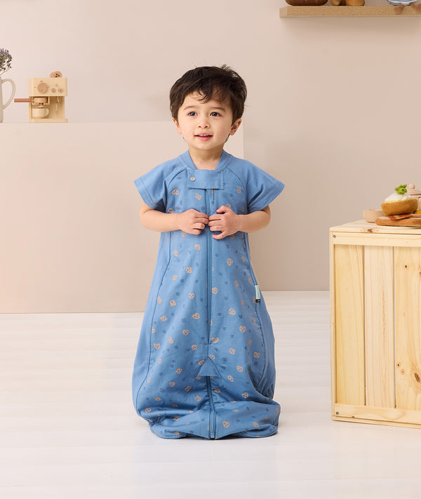 Toddler wearing ergoPouch Sleep Suit bag 1.0 TOG Petit Pretzel