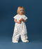 Toddler wearing an ergoPouch Sleep Suit Bag 1.0 TOG Daydream, a sleeping bag that converts to a sleep suit with legs by a four-way zipper feature. 