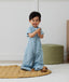 Toddler wearing an ergoPouch Sleep Suit Bag 1.0 TOG Dragonflies