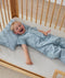 Toddler wearing an ergoPouch Sleep Suit Bag 1.0 TOG Dragonflies