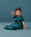 Toddler wearing an ergoPouch Sleep Suit Bag 1.0 TOG Ocean Blue