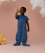 Playing toddler wearing an ergoPouch Sleep Suit Bag 1.0 TOG Starbeam, a sleeping bag that converts to a sleep suit with legs.