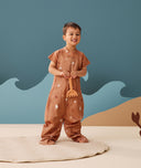 Preschooler wearing an ergoPouch Sleep Suit Bag 1.0 TOG Sunny